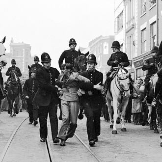 Eddie Worth, An anti-fascist demonstrator is taken away under arrest after a mounted baton charge during the Battle of Cable Street, London, 4, October 1936. Courtesy of the National Galleries of Scotland
