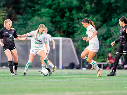 Women’s football teams playing under  pressure, symbolising the win–loss framework that defines most international sporting exchanges