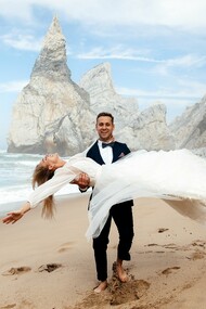 Barefoot on golden sand, this couple proves that the perfect wedding destination is wherever joy meets jaw-dropping scenery