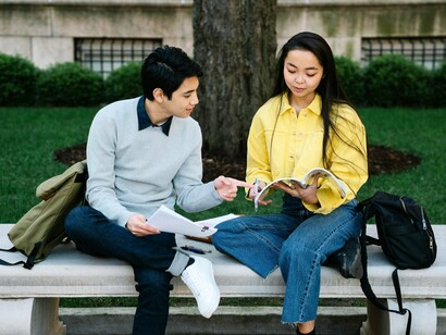 Two students focused on their studies, highlighting the resilience and determination of Ormocanon youth