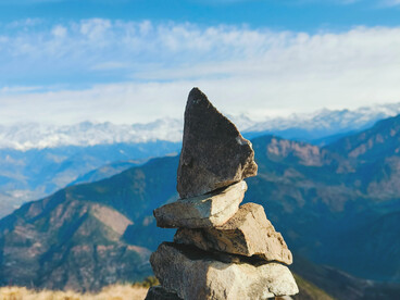 Stacked stones overlooking the Himalayan mountains