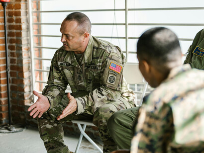 A war veteran in a counseling session, revealing the deep emotional scars and trauma of combat