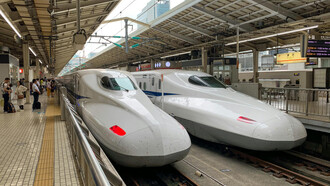 White Shinkansen bullet trains at Tokyo train stations showcase Japan's advanced railway technology and efficient public transport system, Japan