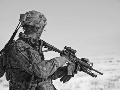 A soldier guarding his nation, signifying the sacrifice of brave men and women willing to protect their nations