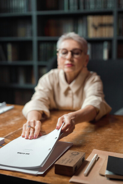 A woman proofreading a draft before publication