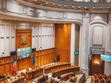 The interior of a large domed building, used as a parliament