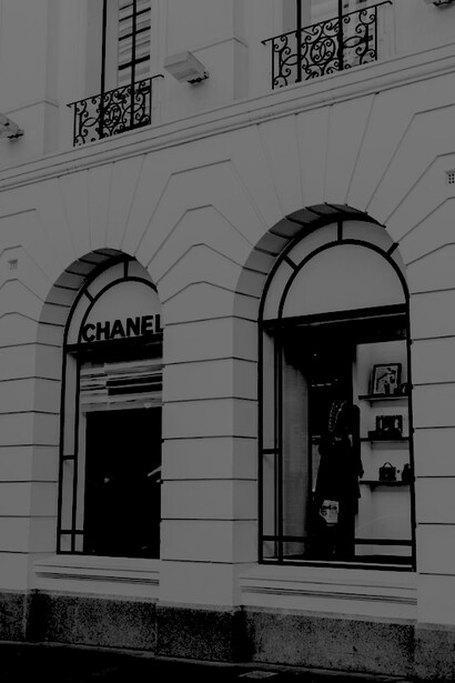 Chanel store window display with a mannequin