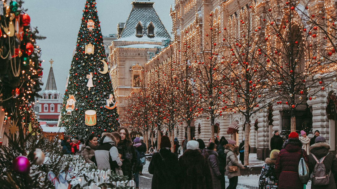 Urban Christmas decorations and a bustling shopping crowd in Moscow, Russia