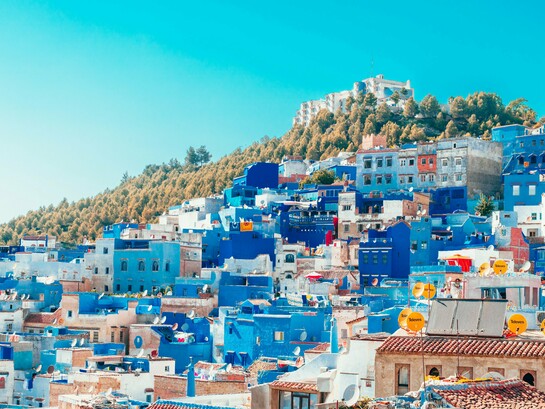 The iconic blue houses of Morocco, representing a country moving forward with confidence and stability