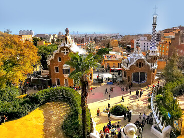 A view of Park Güell in Barcelona, Spain, showcasing its famous mosaic benches and artistic design