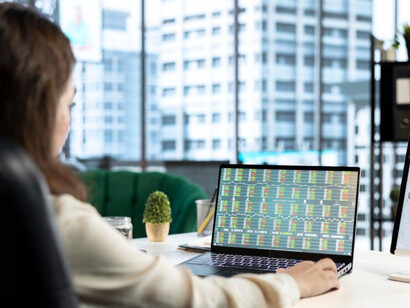 An investor carefully investing in fractional assets using blockchain platforms 