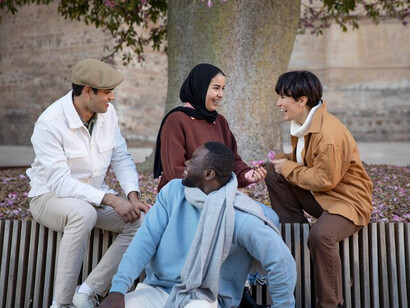 Friends hanging out in a multicultural setting, expats connecting within their immigrant community, and celebrating cultural diversity in Spain