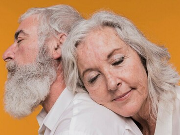 An elderly couple, whose love has stood the test of time, enjoying the beauty of growing old together