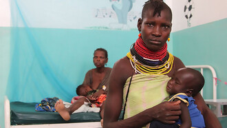 Nakitela Epur is pictured with her eleven-month-old daughter, Epuu, who is recovering well after being treated for acute malnutrition in the pediatric ward in Lodwar District Hospital, in Kenya's northern Turkana county