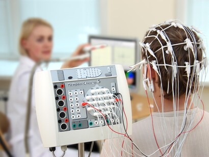 A researcher recording brain activity using electroencephalography (EEG)