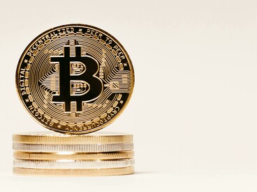 The pile of Bitcoin tokens signifies the digital finance potential of Africa