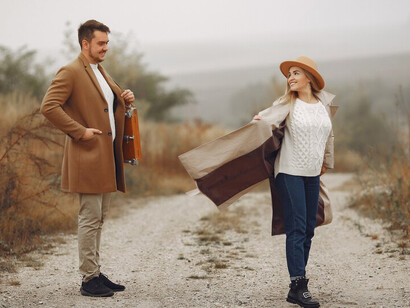 A lovely couple sharing a peaceful moment in an autumn field