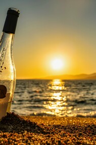 Wine on the sand, under the setting sun—the perfect beginning to a nostalgic and intimate night