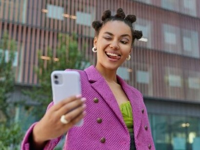 A young woman recording her daily activities and sharing content with followers