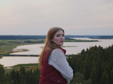 Surrounded by the beauty of nature, this woman is grateful for the balance of 'milk and honey' in her body, where brain and gut work together to enhance her happiness