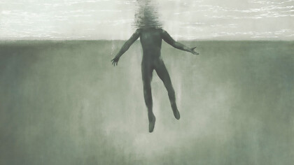 A surreal image of a man submerged underwater, symbolizing the fight for breath