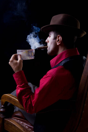 Back view of a man relaxing in an armchair, cigar smoke curling around him, suggesting a mafia aesthetic