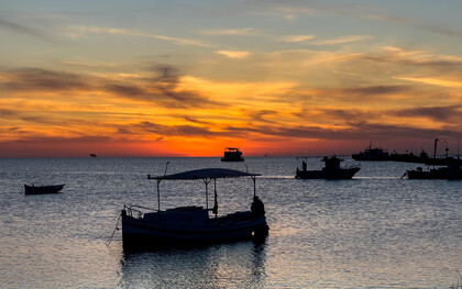 As the sun sets over the island of Kerkannah, Tunisia, the sky becomes a canvas of intense reds and deep oranges, a perfect backdrop for an artist’s reflection, image taken by Pierre Gassin