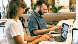 Coworkers using AI tools working smarter and reaching more customers to build a strong brand