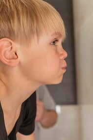 Young boy using mouth wash