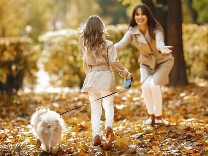 A little girl running to her mother in a park, symbolizing gratitude expressed through connection
