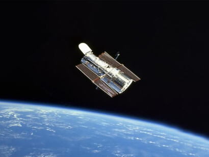 Hubble at the Close of Servicing Mission 3A (1999) Caption Hubble floats gracefully above the blue Earth after release from Discovery’s robot arm at the close of another successful servicing mission, SM3A (STS-103) on December 27,1999