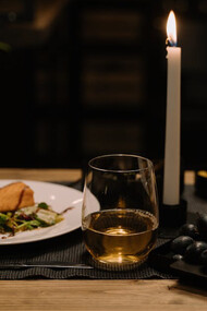 In the midst of chaos and uncertainty, a candlelit dinner offers a comforting reminder that, despite the world's troubles, simple pleasures still abound