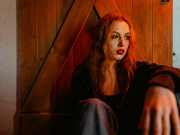 A woman immersed in overwhelming sadness, reflecting the collapse of an outdated love identity