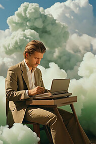 A man typing on his computer, surrounded by soft, floating clouds