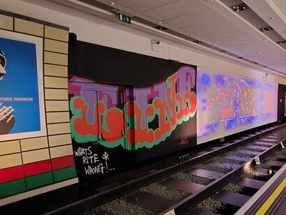 Exhibition view of Banksy’s recreated London Tube station, presented as an installation within the temporary exhibition Banksy Limitless. The work represents a fictional station titled Prankadilly Circus, London, UK
