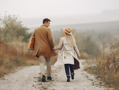 A beautiful couple enjoying their time together in an autumn field