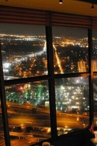 View of San Antonio from the revolving Chart House Restaurant at the Tower of the Americas at night.