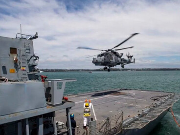 Troops from the U.S. Army’s 10th Mountain Division at Fort Drum, New York, stand assembled on the flight deck of the nuclear-powered aircraft carrier USS Dwight D. Eisenhower (CVN-69) as it heads toward the Caribbean to participate in Operations Able Vigil and Support Democracy off the coast of Haiti