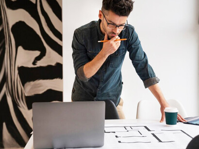 Focused man advancing his project with confidence and a commitment to continuous learning