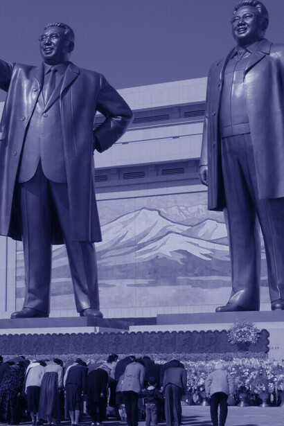 Bowing to the strongmen Kim Il Sung and Kim Jong Il