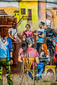 Grafite de pessoas de diferentes nacionalidades em um mesmo espaço. Mais africanos na Europa, mais latinos em África, mais americanos na Ásia, mais asiáticos em África, mais europeus na Austrália