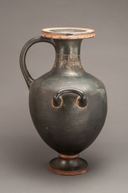 Black-glazed water vessel (Hydria) with gilded details, 4th century BCE. Courtesy of Menil