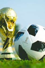 Pre-World Cup 2018,a gleaming gold trophy alongside a soccer ball, hinting at the excitement to come