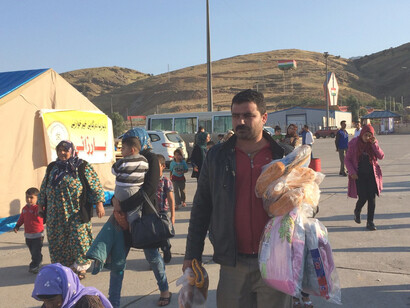 Hundreds of Syrian families have been arriving daily at the Ibrahim Khalil checkpoint on the Turkey–Iraq border, escaping violence in Kobane and surrounding areas of southern Syria, while more than 10,000 refugees have sought refuge in the Kurdistan Region of Iraq since mid-September