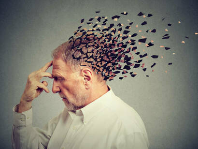 A person struggling with memory loss, as their recollections fade and blend into surreal, dreamlike images