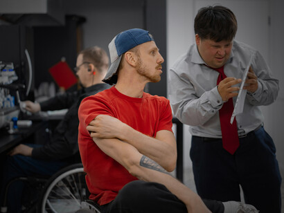 People using wheelchairs working in a coffee shop as part of an inclusive workplac