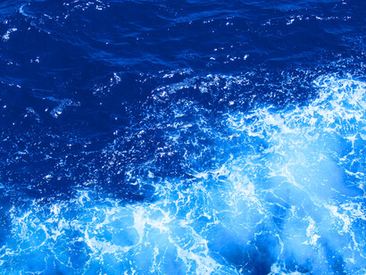 Clear blue waters shifting in soft waves, reflecting the stillness that comes when you surrender your weight to something larger