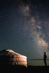 A lonely man beside a tent