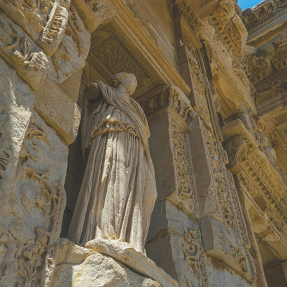 An ancient Greek sculpture set amid the historic ruins of Ephesus, Turkey