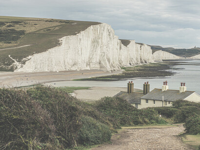 The Seven Sisters are a striking stretch of chalk cliffs on the English Channel, carved by the sea along the South Downs in East Sussex